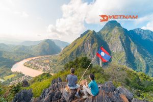 Information couple conquering mountain top nong khiaw panoramic view nam ou river valley laos national flag scenic mountain landscape 1: Motorbike Tours Laos - Vietnam Motorbike Tours