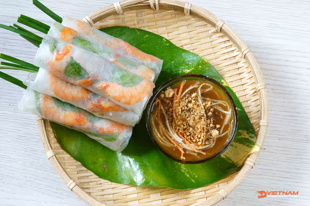 Vietnamese food, goi cuon is street food, roll that delicious, wrapped from shrimp, pork, vegetables, bun in rice paper, with accompaniments: sauce, chili, another name: salad roll, soft roll..Ho Chi Minh City