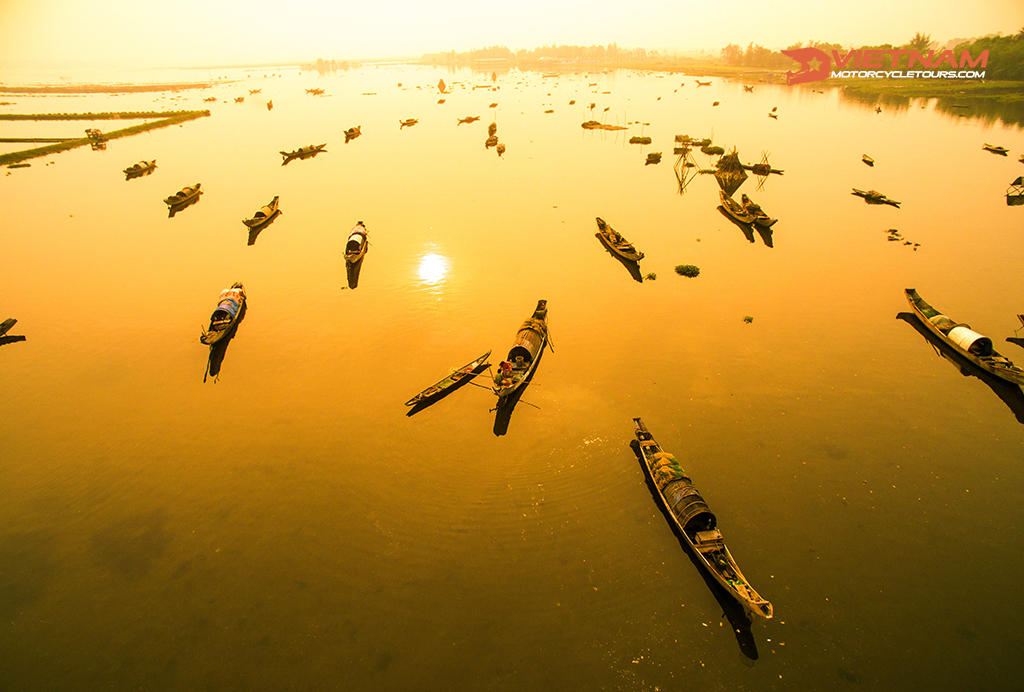 Boats in Tam Giang lagoon in sunrise from drone.Hue, Vietnam